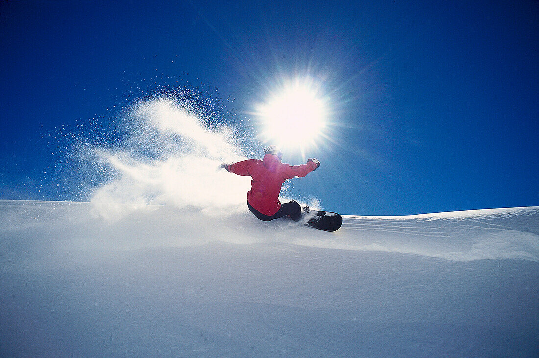 Snowboarder on slope, Arlberg, Vorarlberg, Austria