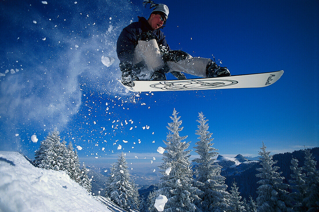 Snowboarding, Jumping snowboarder, Vorarlberg, Austria