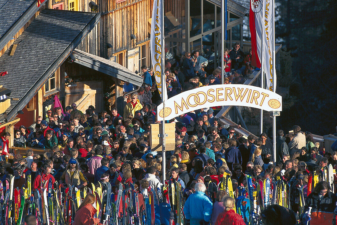 People sitting outside at ski lodge, Mooserwirt, St. Anton at Arlberg, Tyrol, Austria