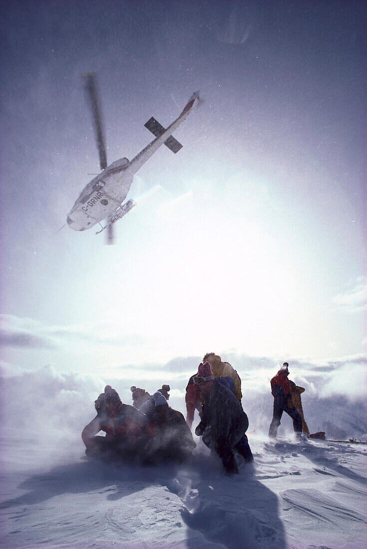 Heli Skiing, people on a snow covered mountain top, Cariboos, Canada