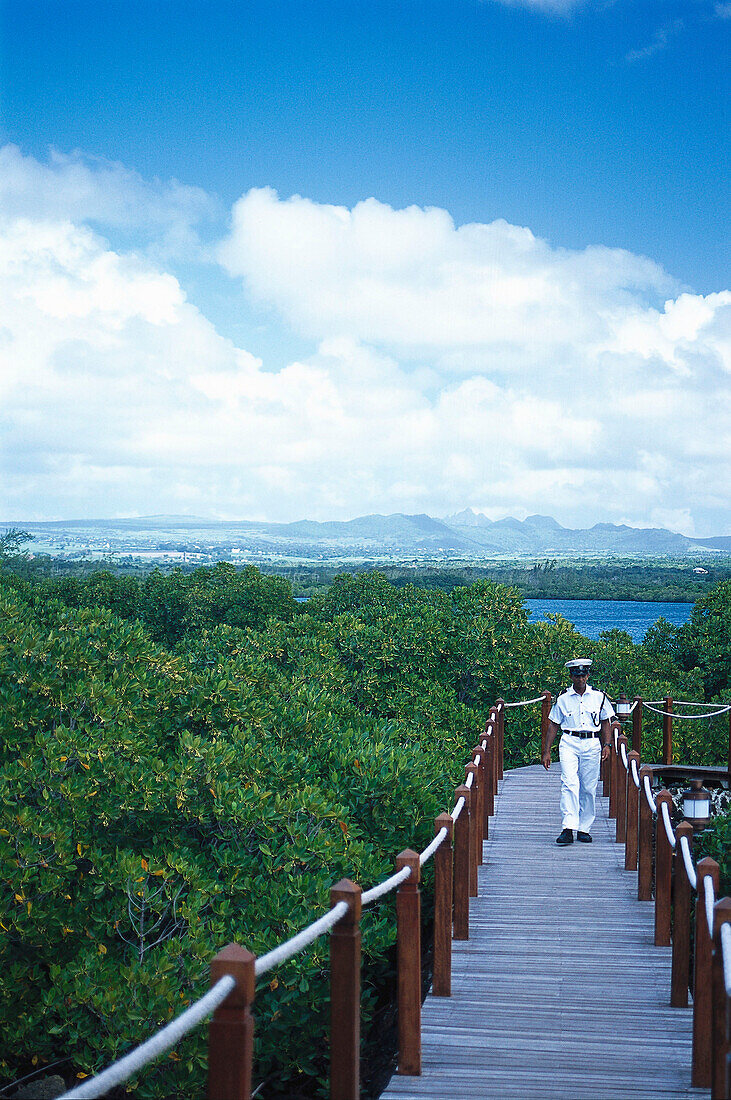 Member of the security service on a jetty, Hotel Le Prince Meurice, Mauritius, Africa