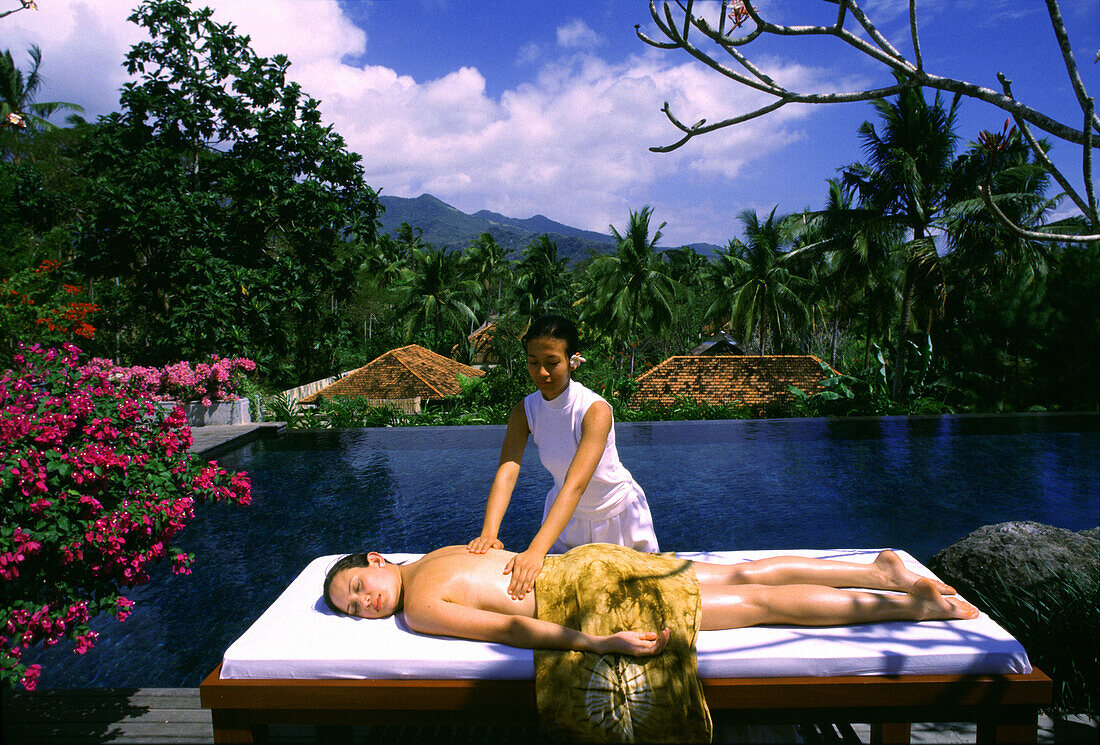 Woman getting a massage in a resort, The Farm, Batangas Province, Philippines, Asia