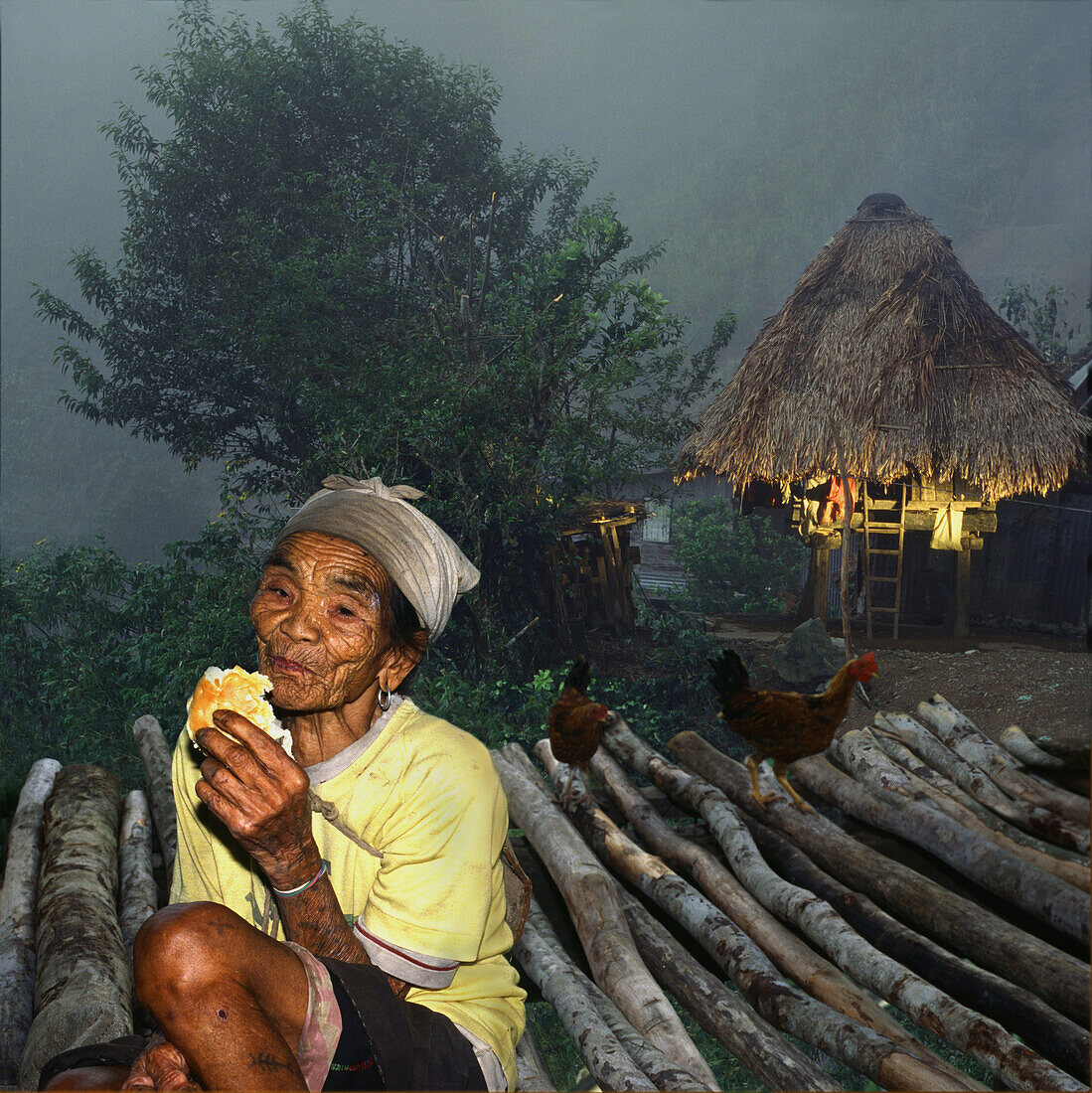 Ifugao women and hut, Banaue, Luzon Island Philippines