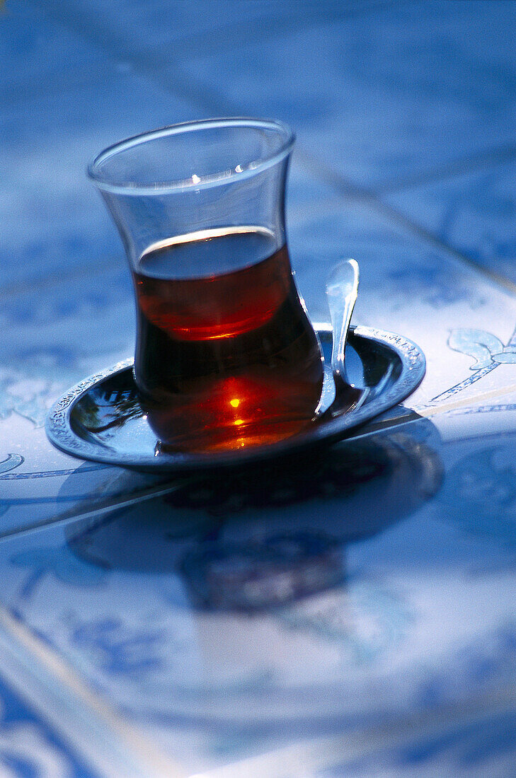Traditional black tea, Sunset reflecting in the glass, Aegaen Sea, Turkey