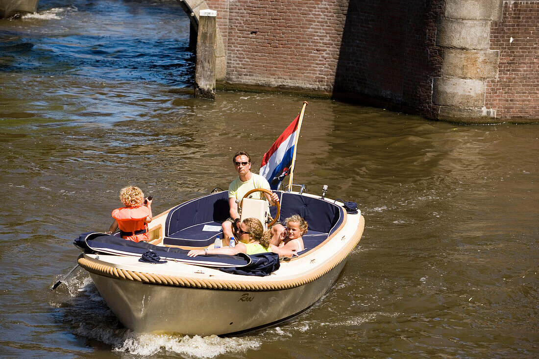 Family, Leisure Boat, Keizersgracht , Family having a trip with a leisure boat on Keizersgracht, Amsterdam, Holland, Netherlands