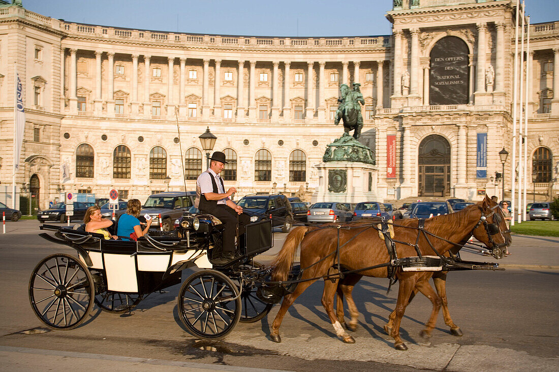 Fiaker passing the Neue Hofburg during a city tour, Vienna, Austria