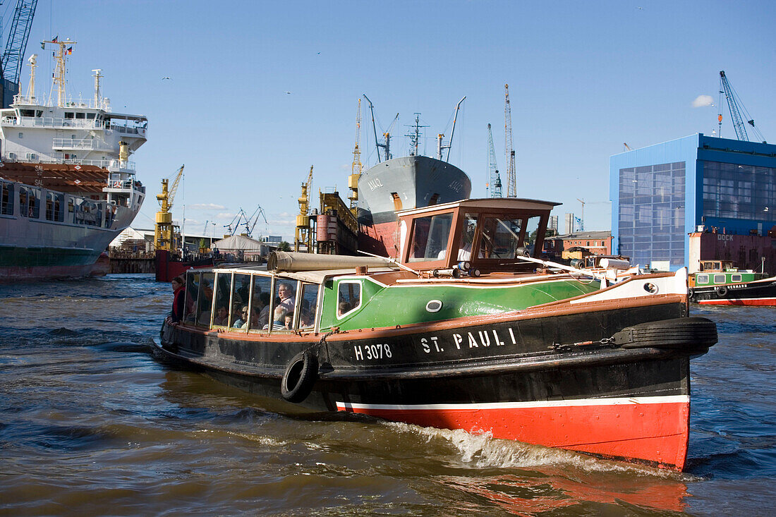 Harbour tour with a barge, People having a harbour tour with a barge at harbour, Hamburg, Germany