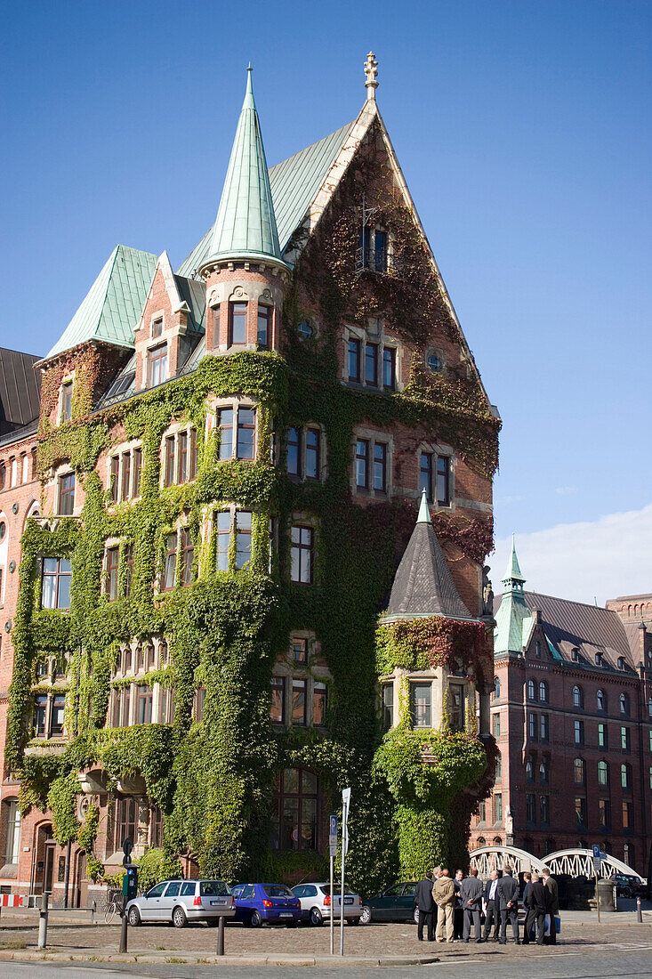 Overgrown brick-lined building, Speicherstadt, Hamburg, Germany