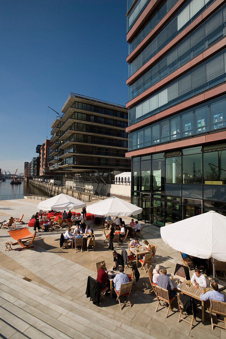 Restaurant at Hafencity, People in a open-air cafe at Hafencity, Hamburg, Germany