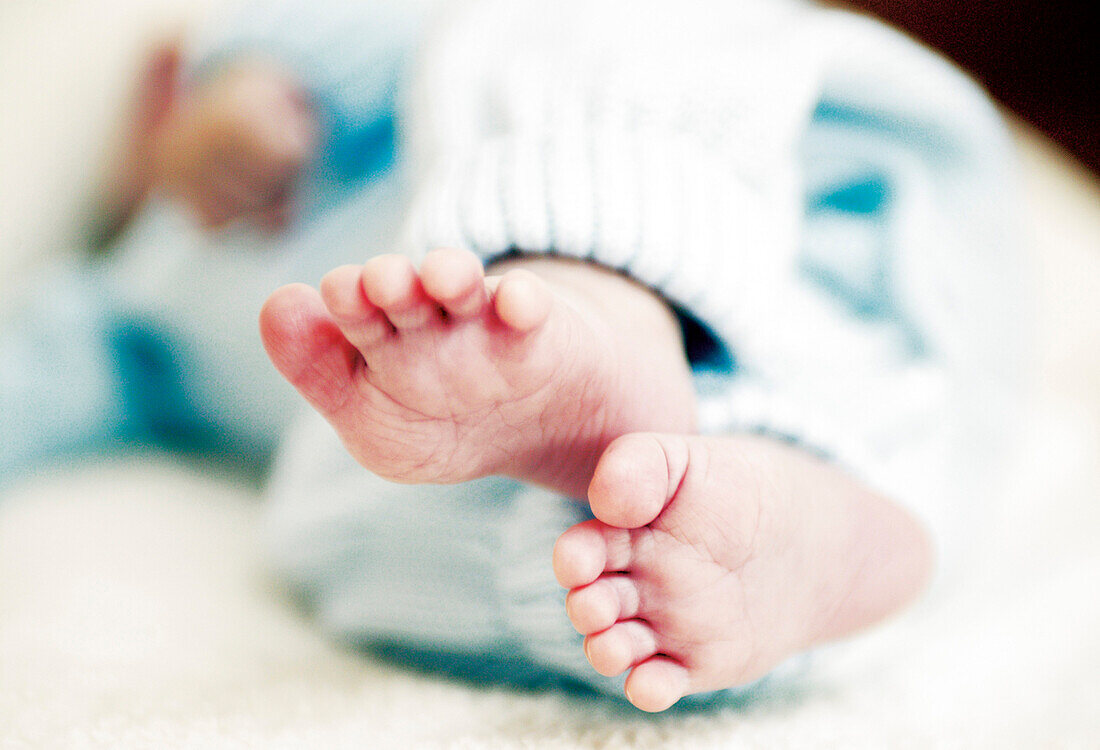 Feet of a baby, lying on back