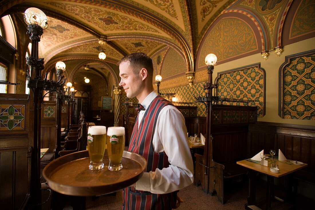 Waiter serving beer in the Karpatia Restaurant, Waiter serving beers in the Karpatia Restaurant, Pest, Budapest, Hungary