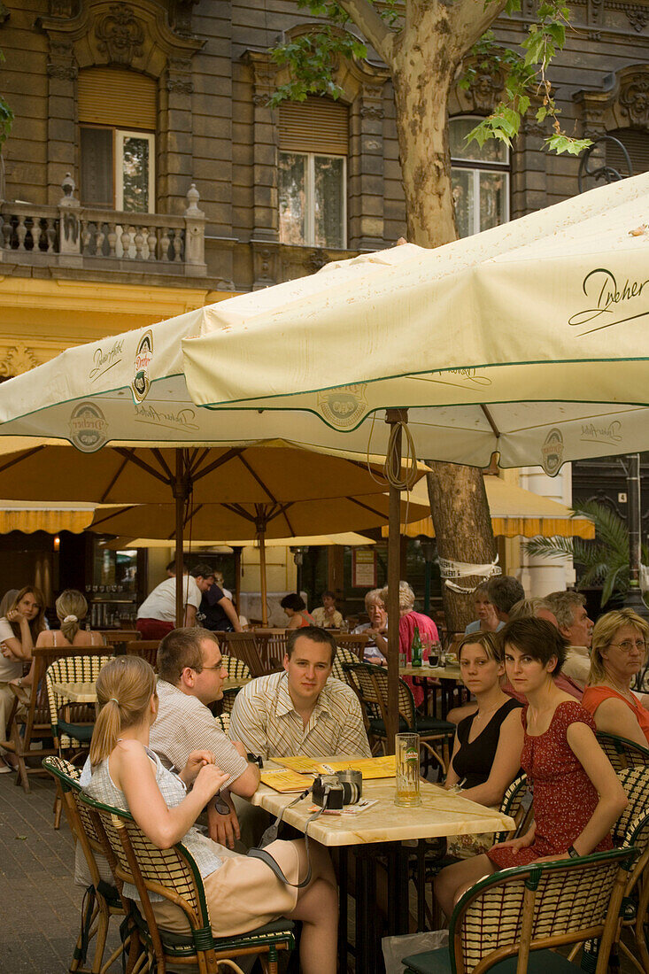 People in open-air cafe, Young people sitting in an open-air Cafe at Liszt Square, Pest, Budapest, Hungary