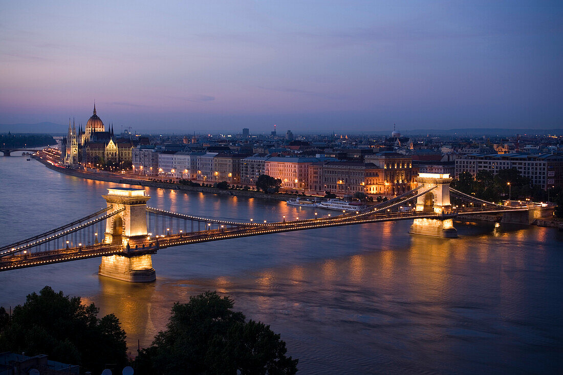 View over the river Danube with Szechenyi Chain Bridge to Pest with the Parliament in the evening, Pest, Budapest, Hungary