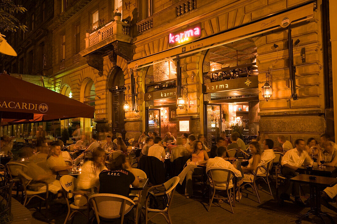 People in the open-air Cafe Karma at night, People sitting in the open-air Cafe Karma at Liszt Square at night, Pest, Budapest, Hungary
