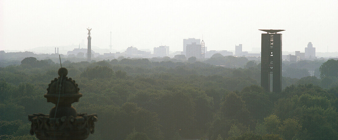 View over Tiergarten with victory column and Carillon bell tower in the background, Berlin, Germany
