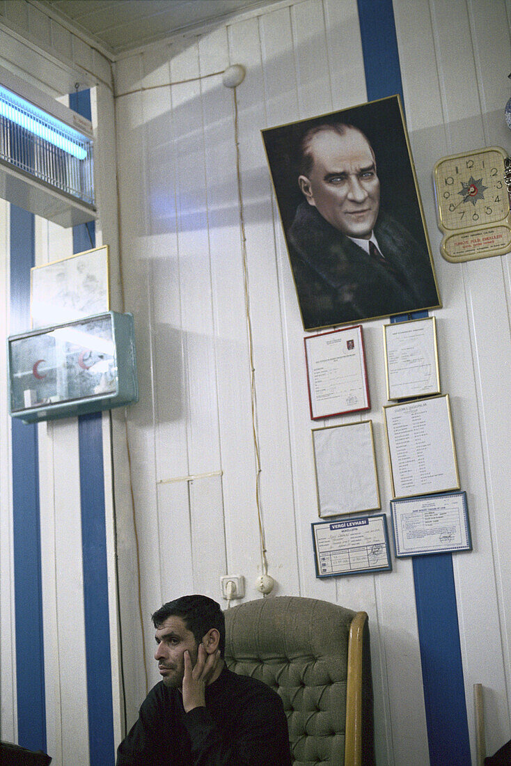 Man with portrait of Mustafa Kemal Atatuerk, Istanbul, Turkey