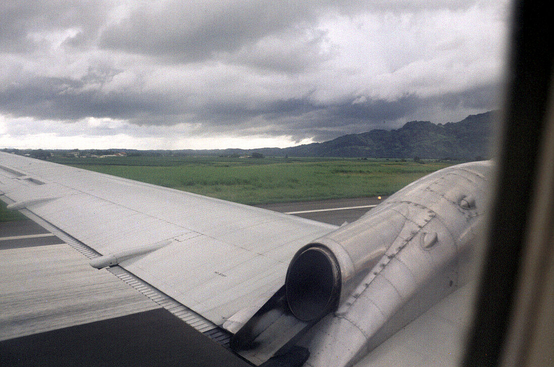 View out of the window of an airplane during the take off, Fiji, South Pacific