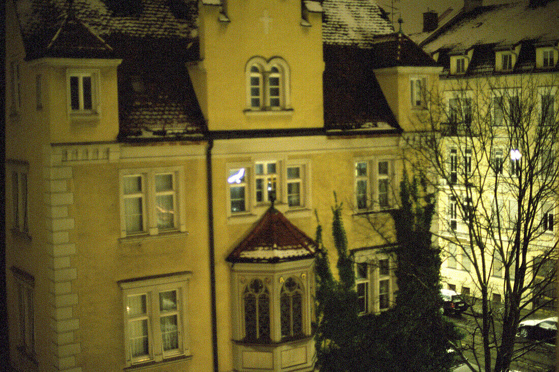 Snow covered houses at the district Neuhausen at night, Munich, Bavaria, Germany