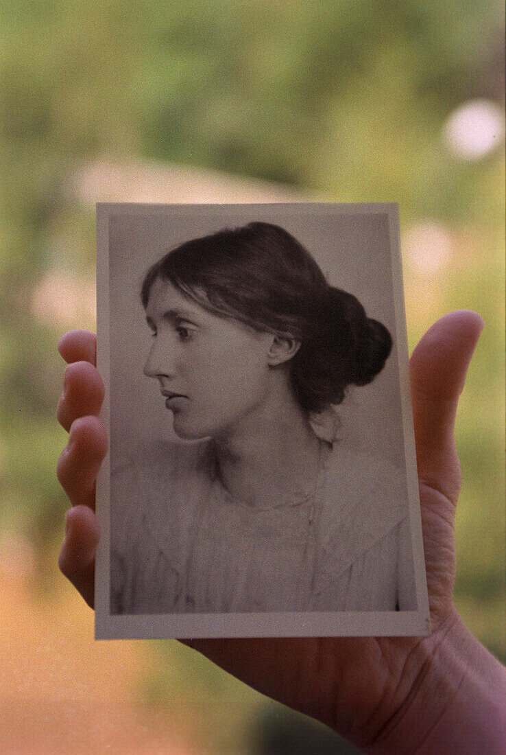 Hand holfing postcard of Virginia Woolf, England, UK
