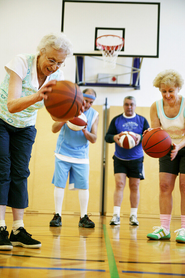 Mature People playing basketball
