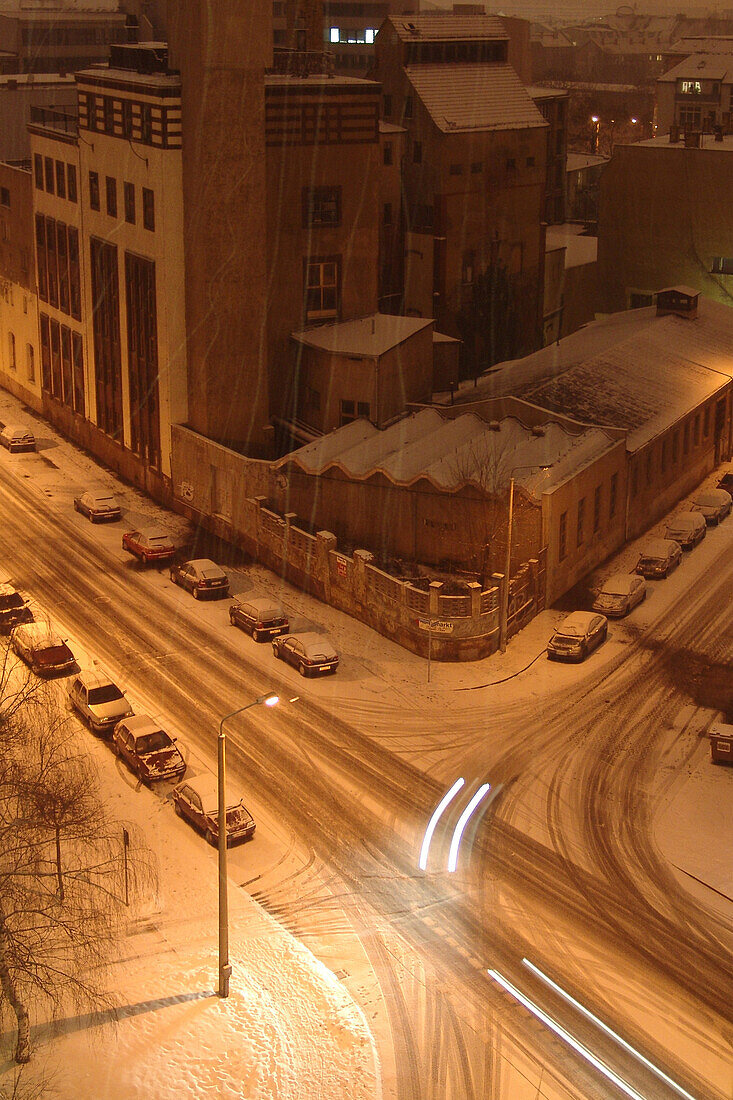 Illuminated crossroads in the winter at night, Leipzig, Saxony, Germany