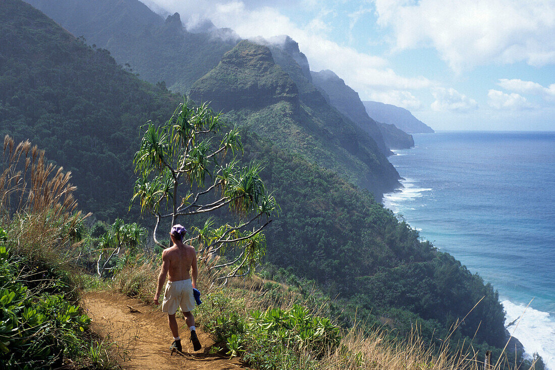 Hiking along Kauai Coastline, Kalalau Trail, Na Pali Coast, Kauai, Hawaii, USA
