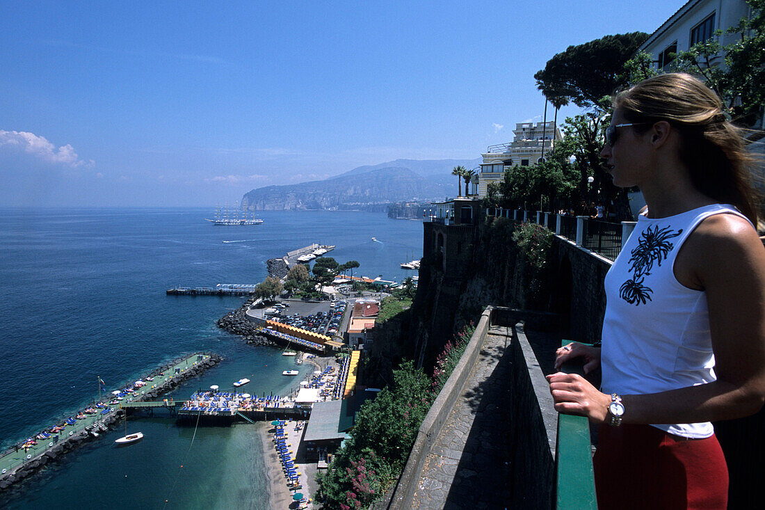 Woman looking over sorrento Coastline, Campania, Italy
