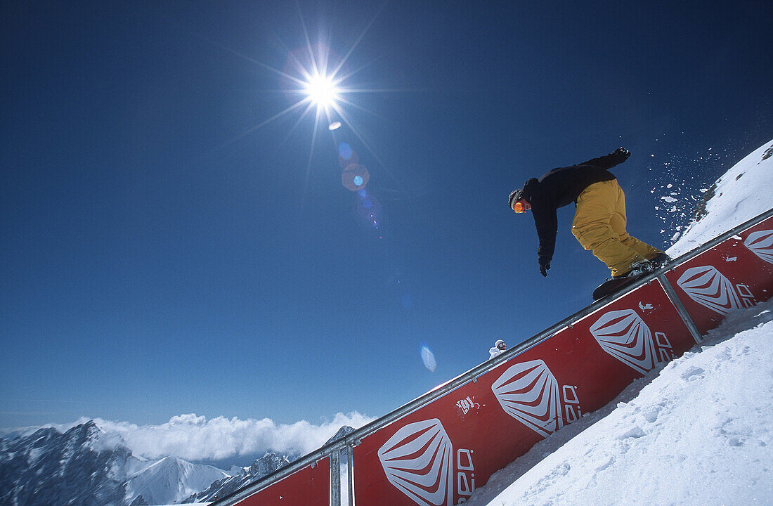 Snowboarder on Railing, Zugspitze, Garmisch Partenkirchen, Germany