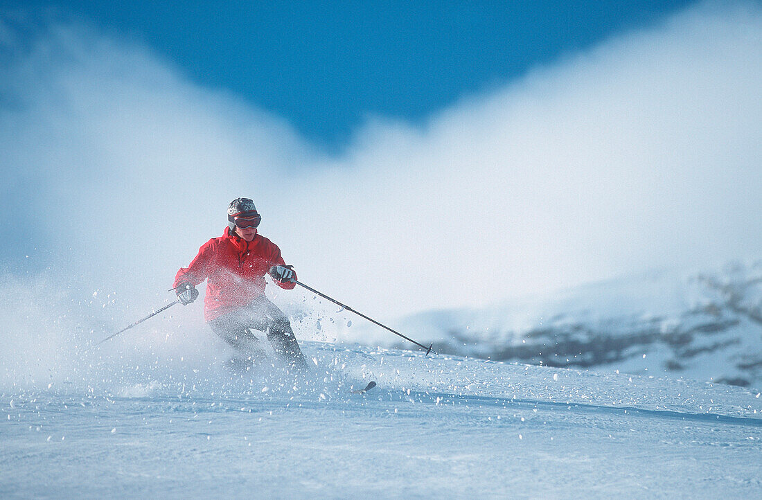 Woman telemark skiing in fresh powder snow, front view, Zugspitze, Garmisch-Partenkirchen, Germany