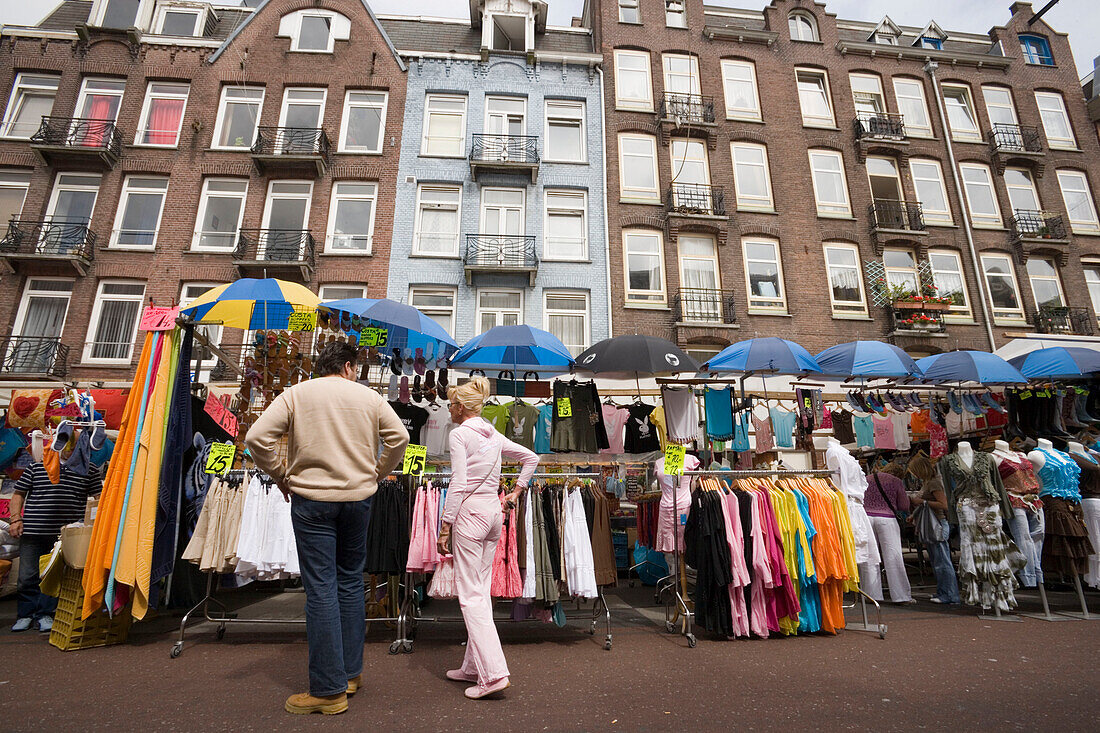 Couple, Market Stand, Albert Cuypstraat Market, Couple sauntering along market stalls at Albert Cuypstraat Market, Amsterdam, Holland, Netherlands