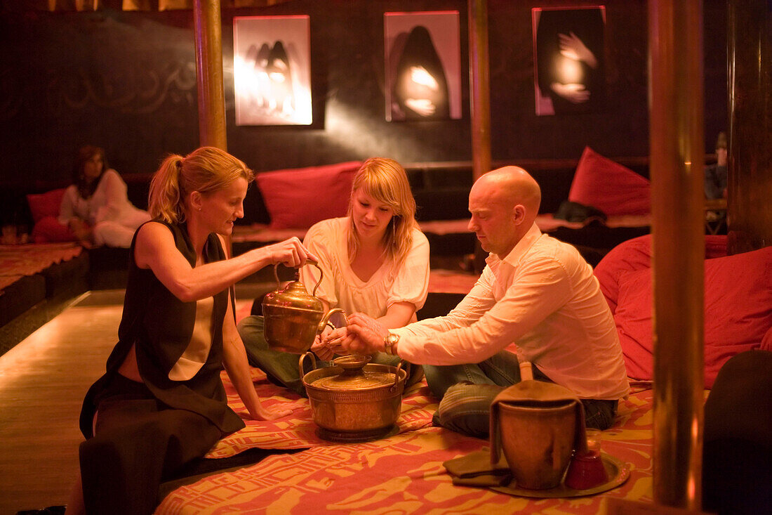 People, Nomads, Restaurant and Club, Couple washing hands islamic conventions, , waitress serves water, Nomads arabic style restaurant and club, , Amsterdam, Holland, Netherlands