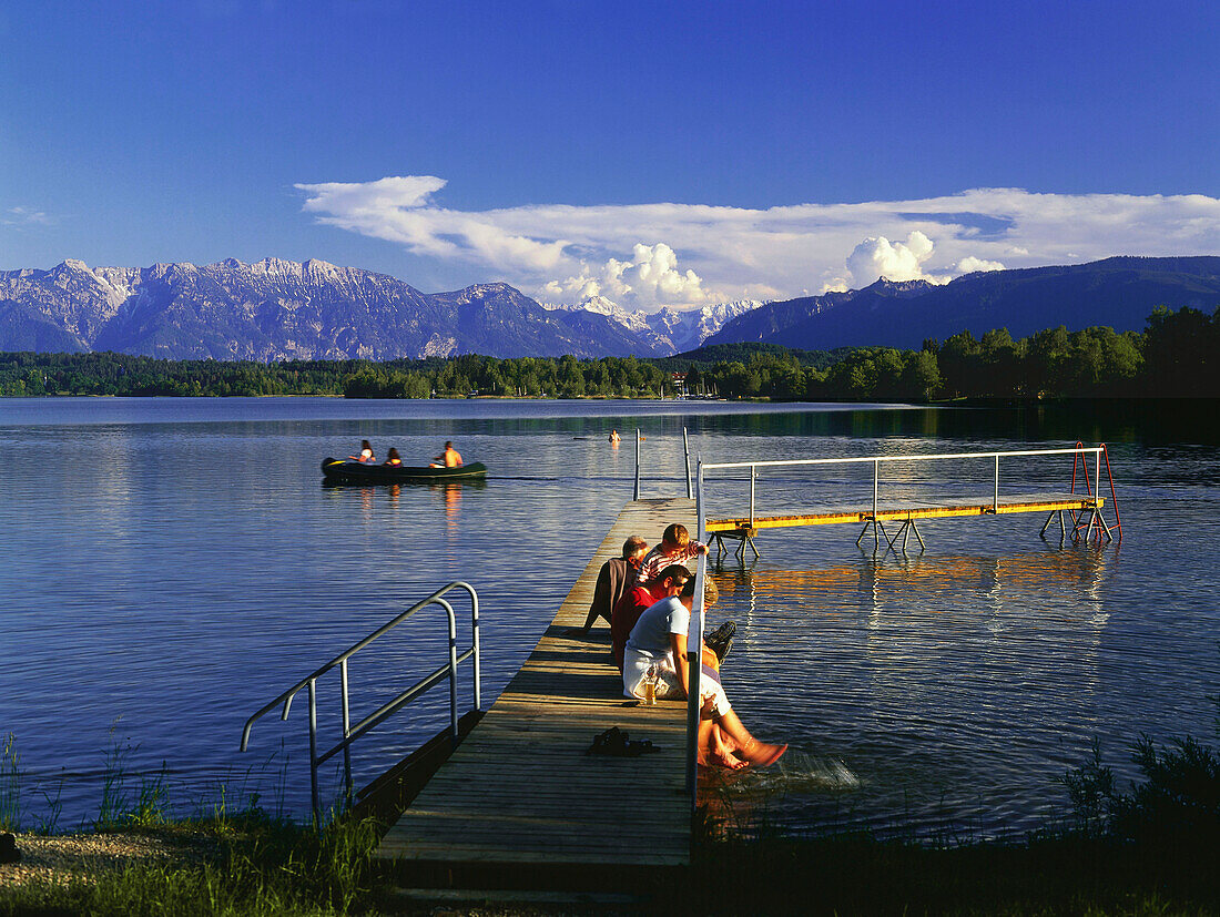 Group of people on jetty, Staffelsee, Upper Bavaria, Germany