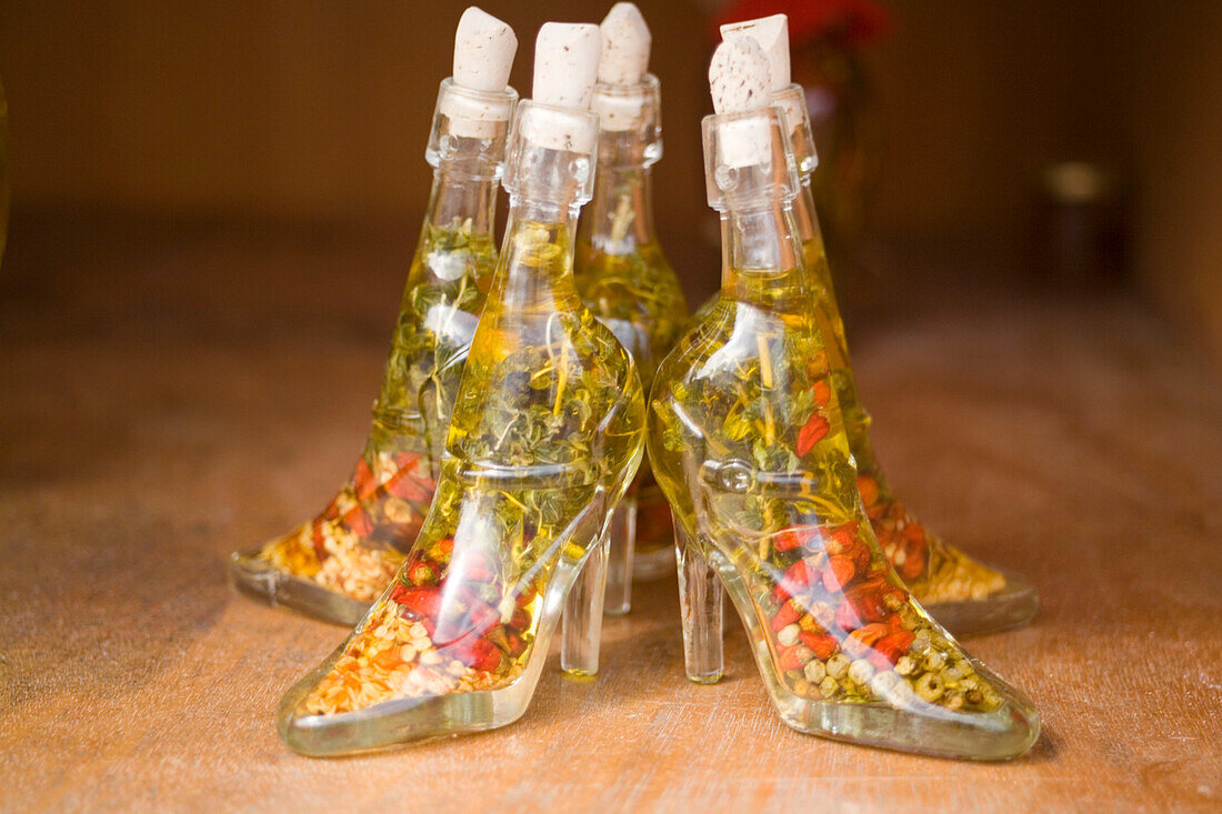 Glass shoe bottled with oil in a souvenir shop, Zia, Kos, Greece