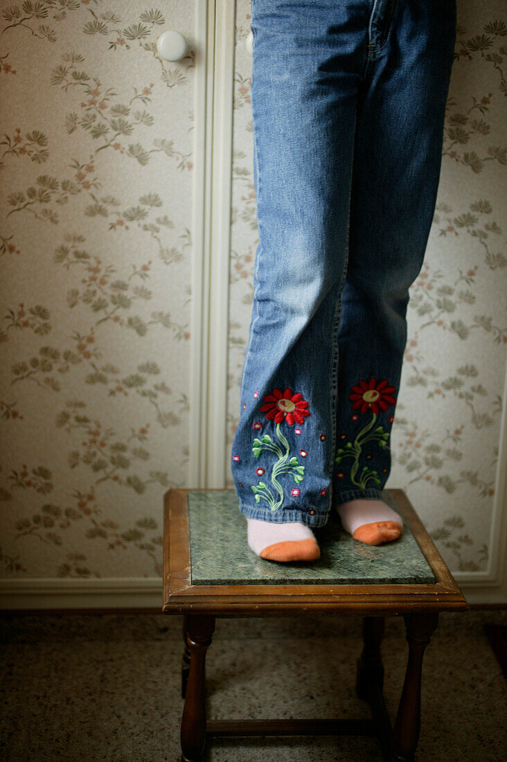 Girl standing on stool