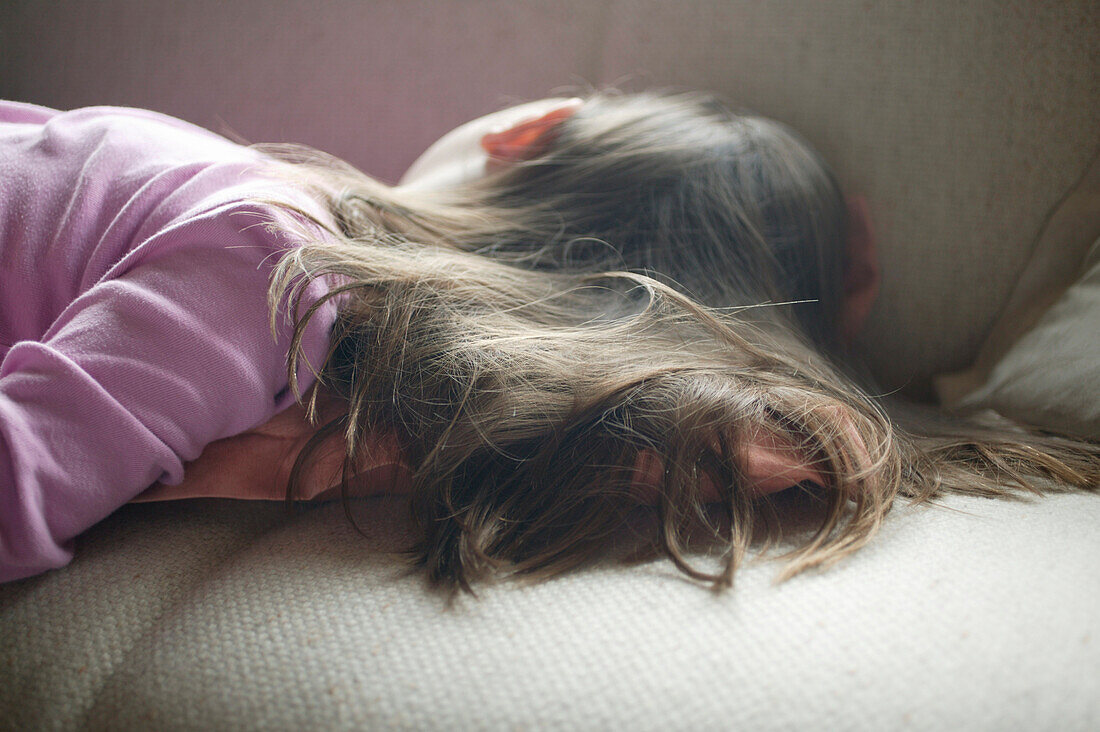 Girl sleeping on sofa
