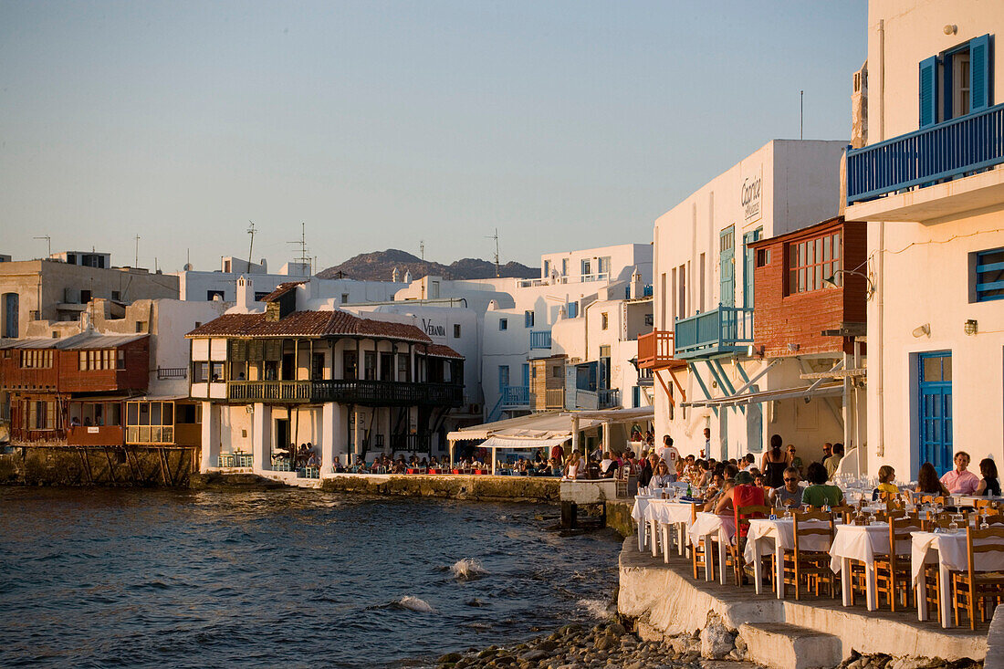 People sitting in a restaurant at beach, Little Venice, Mykonos-Town, Mykonos, Greece