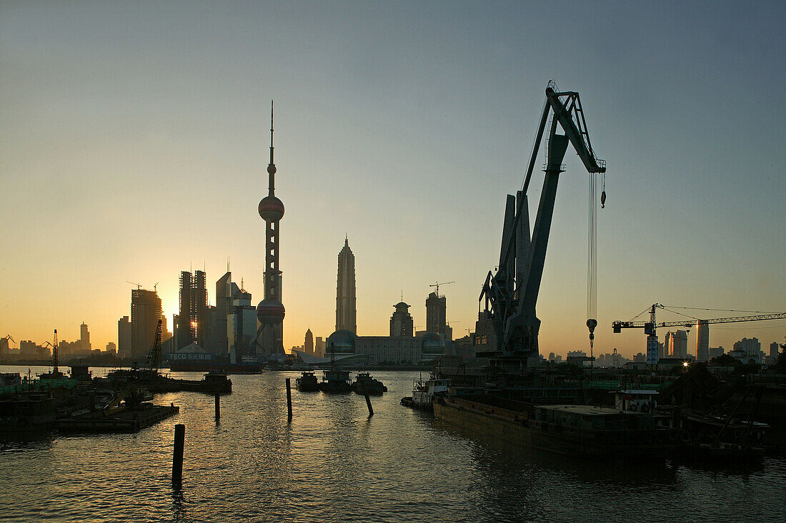 Harbour,View from Waibaidu Bridge, Huangpu-River, Pudong, line of freight barges, man with helmet