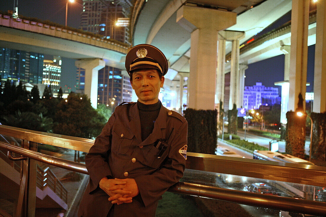 security guard, below elevated highway, Shanghai