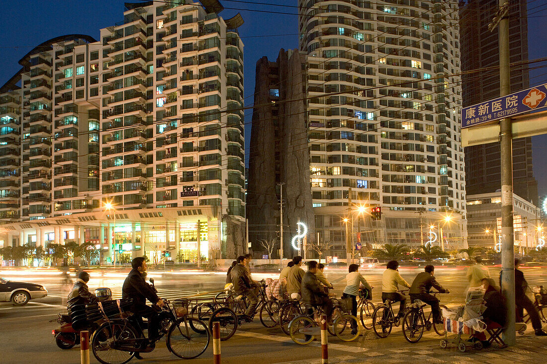 bicycle traffic, apartment towers at night, Zhabei district, Shanghai