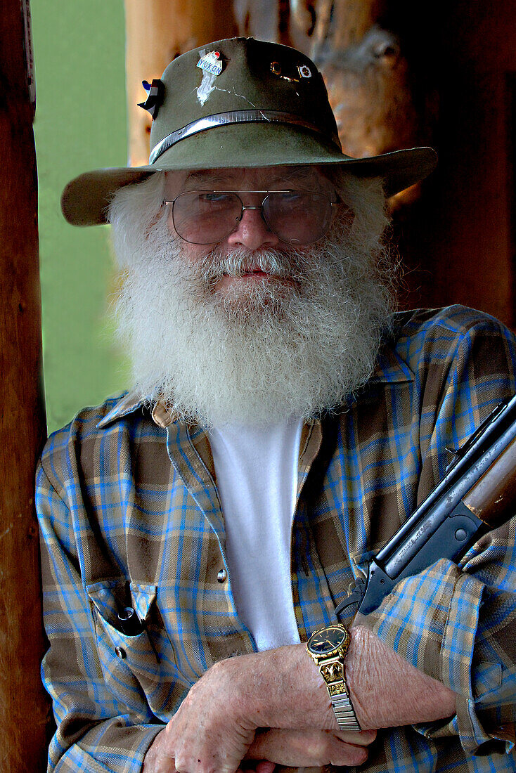 Man with Rifle in Alaska, USA