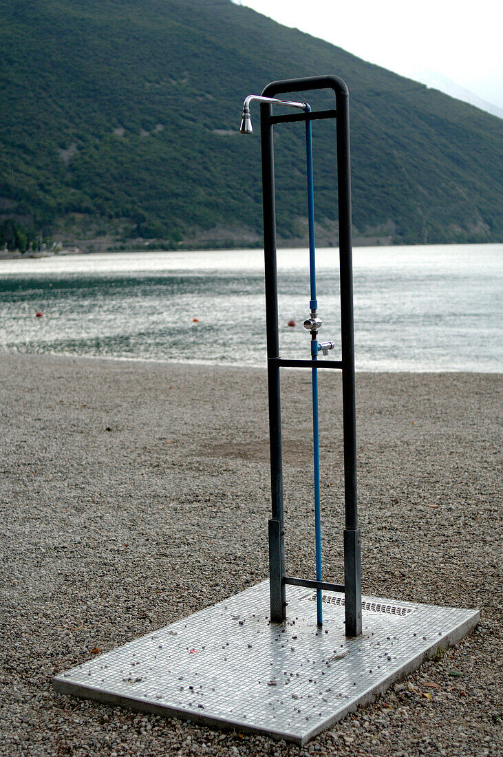 Shower at the shore of Lake Garda, Riva, Veneto, Italy