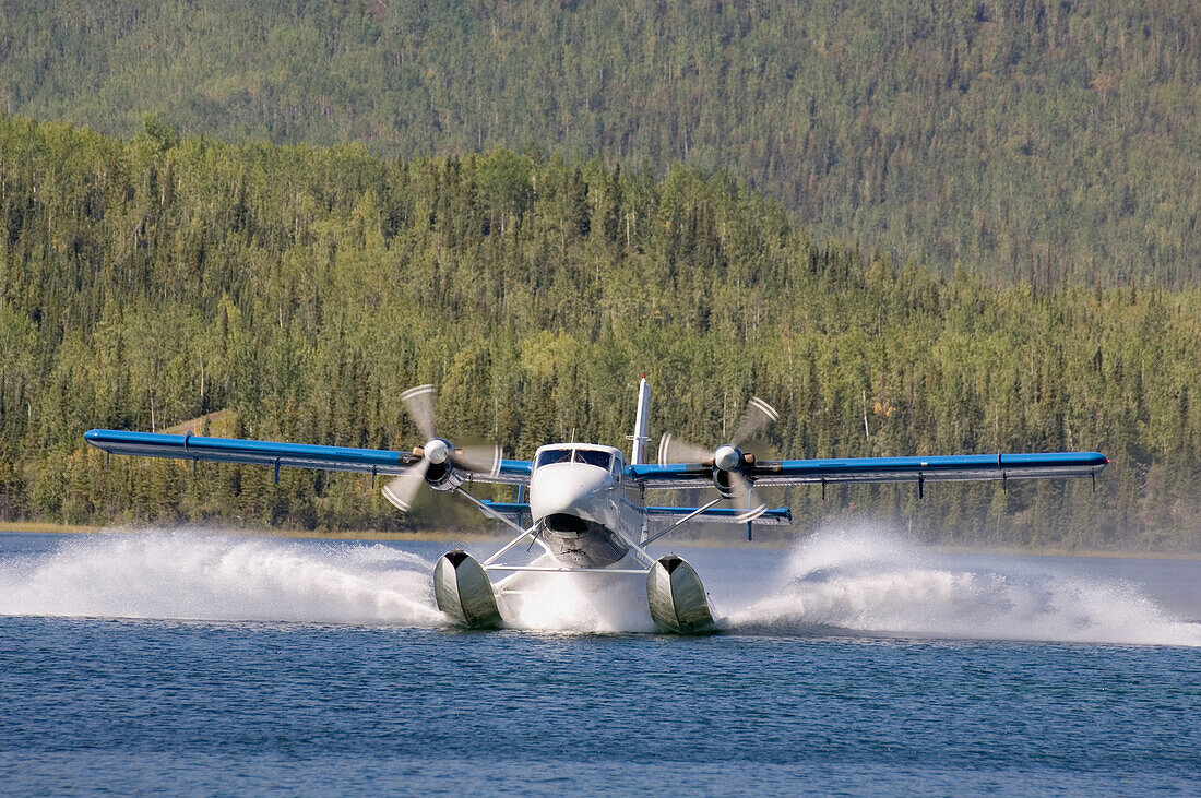 Plane landing on a lake, Canada