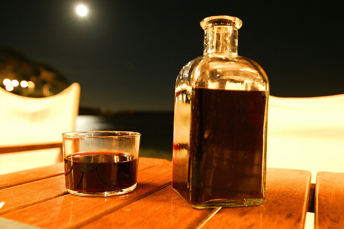 Costa Brava,Glass and Bottle of Wine, Moonlight, Beach at Calella, Costa Brava, Catalonia Spain