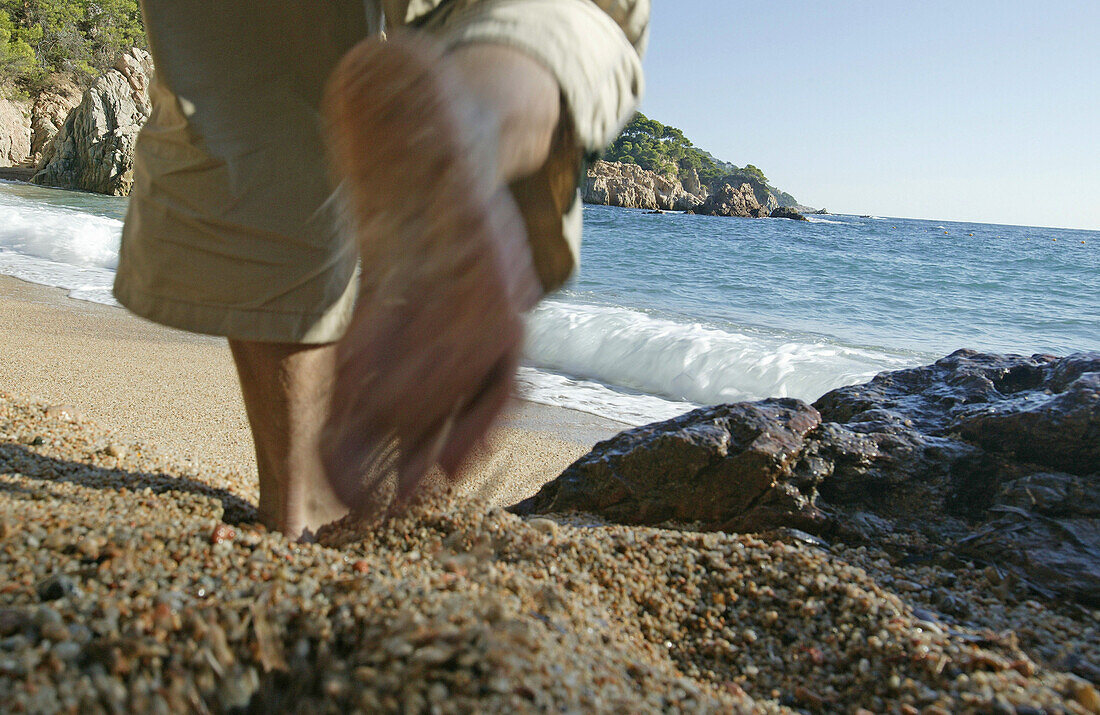 Costa Brava,Feet, Beach at Cap Roig near Calella, Costa Brava, Catalonia Spain