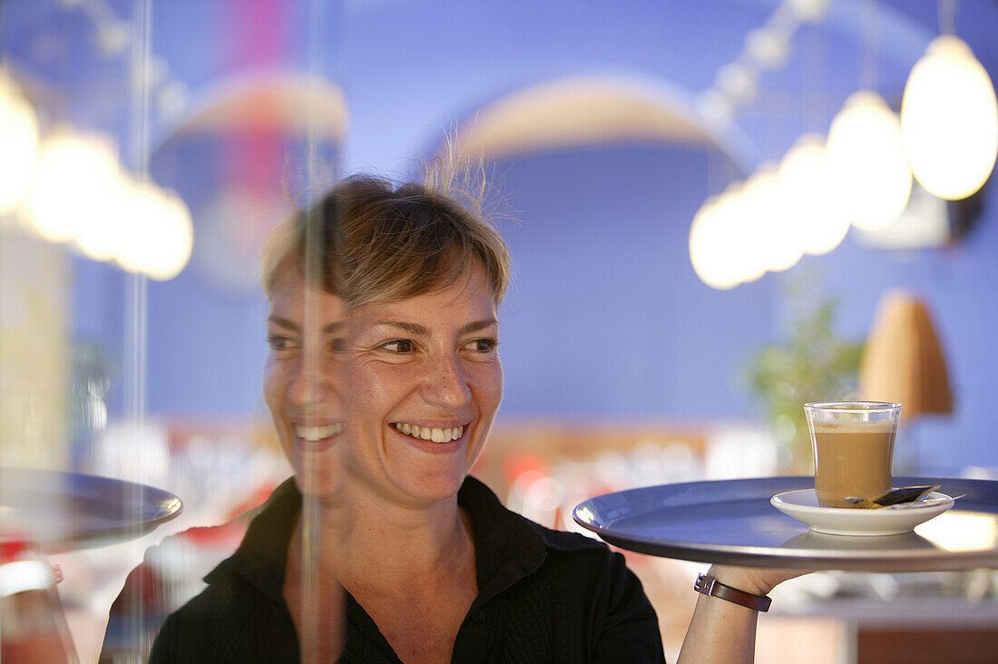 Waitress with coffee, Hotel de la Moneda, Castello d' Empuries, Costa Brava, Catalonia, Spain