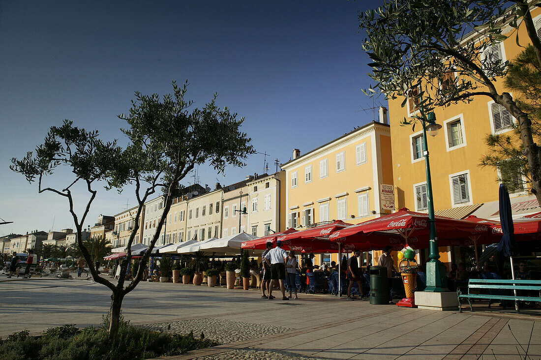 Cafe and houses along the waterfront, Mali Losinj harbour, Cres Island, Croatia