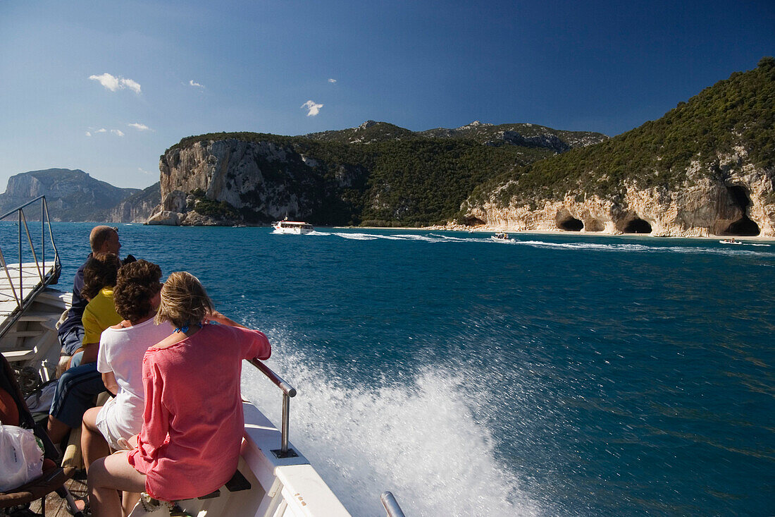 Boat trip along the coast near Cala di Luna beach, Sardinia, Italy