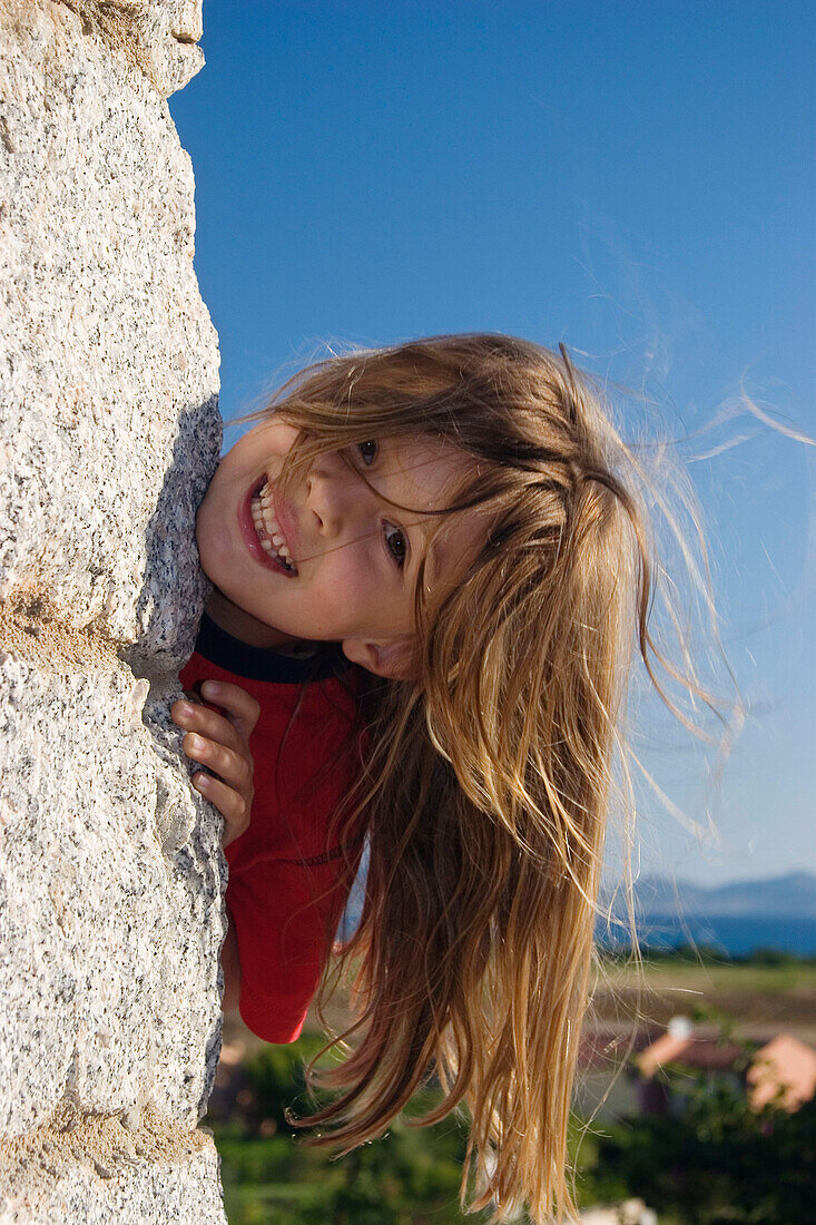 Little girl with long hair smiling