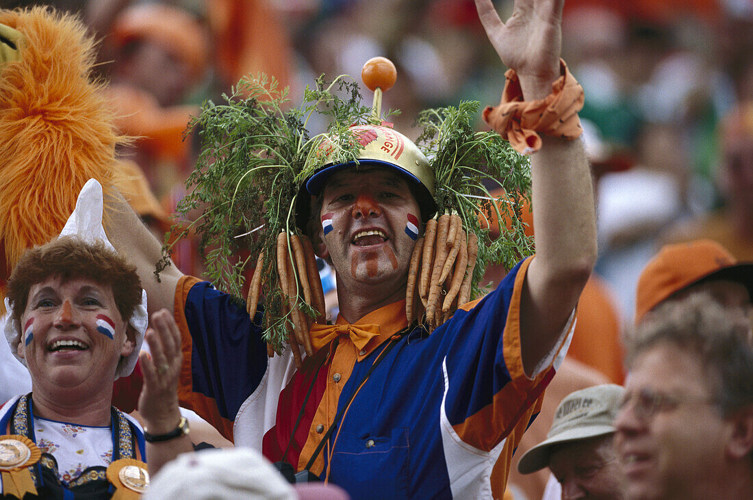 Dutch football fans wearing a headdress