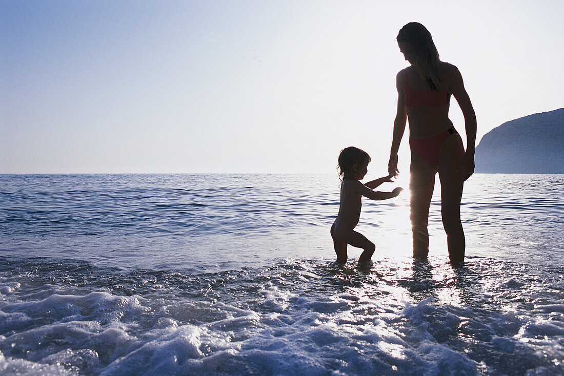 Mother and daughter in the water